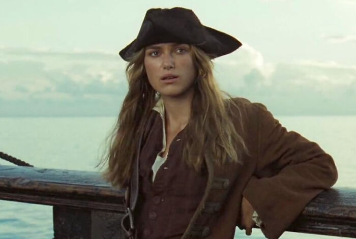 Keira Knightley as Elizabeth Swann, a popular celebrity, on a ship. Some people are disillusioned by celebrities.