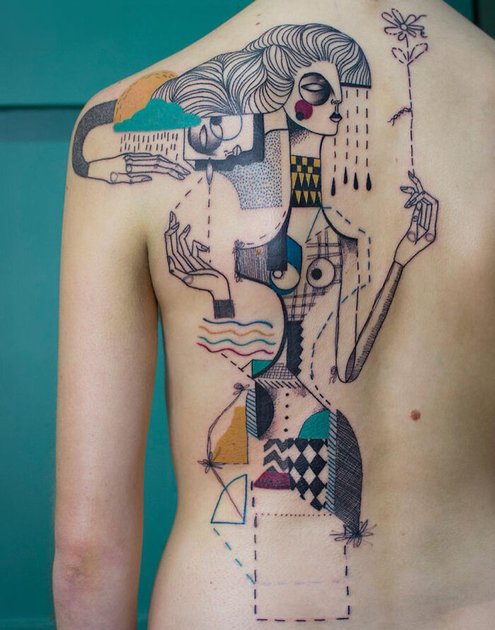 Abstract, colorful tattoo art on a womans back, featuring geometric shapes and stylized figures, an inspiring example of tattoo art.