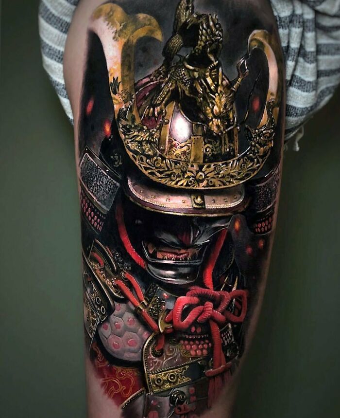 Detailed samurai armor tattoo art covering an entire thigh, inspiring examples.