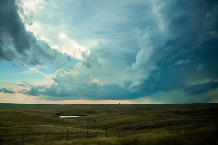 Remarkable color photos from the reFocus Contest: a dramatic storm brewing over vast fields.