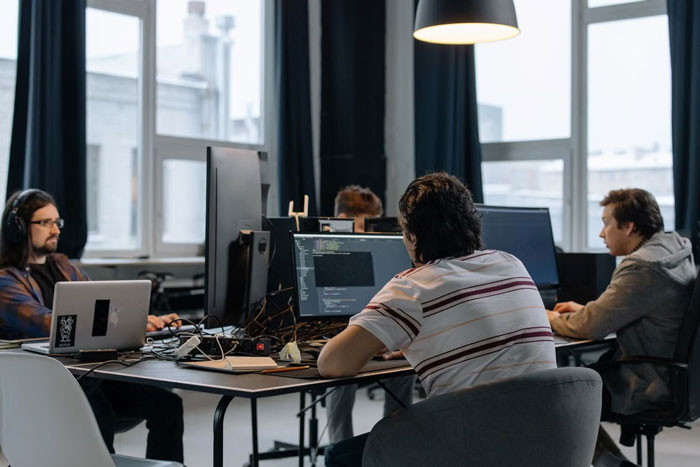 An IT guy and his colleagues working in an office after greedy bosses fired their only IT guy. An IT guy and his colleagues working in an office after greedy bosses fired their only IT guy.