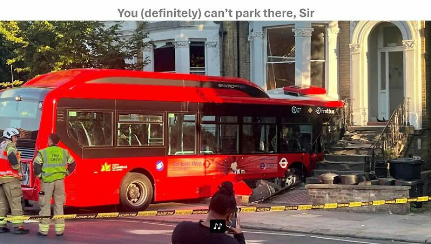 A red double-decker bus crashed into the front steps of a building, with emergency crew present, can't park there.
