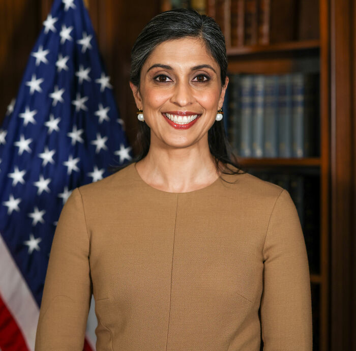Usha Vance smiling in front of an American flag and bookshelf. Americans point out glaring irony after her fourth child's birth. Usha Vance smiling in front of an American flag and bookshelf. Americans point out glaring irony after her fourth child's birth.