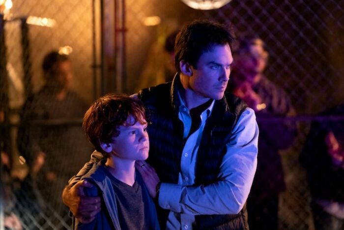 Teen heartthrob, Ian Somerhalder, with a young boy, looking away, after he quit Hollywood.