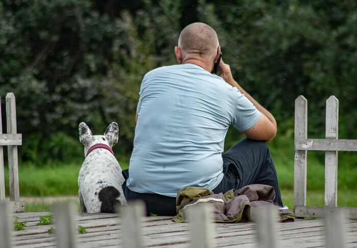 A man on the phone with his dog, a guest who instantly knew they would never return to this home.