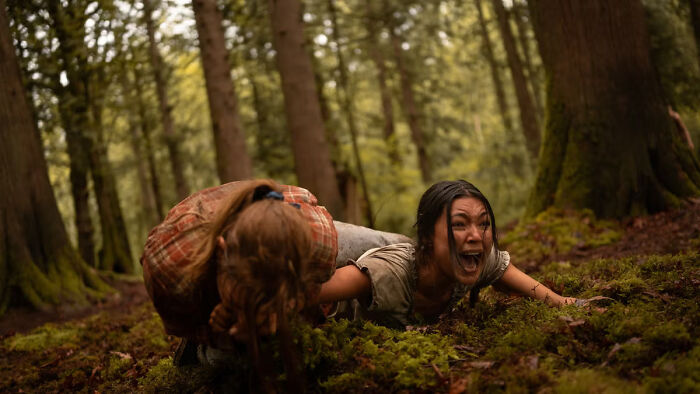 Two women struggling in a survival scene, highlighting Hollywood's obsession with a flawless look. Two women struggling in a survival scene, highlighting Hollywood's obsession with a flawless look.