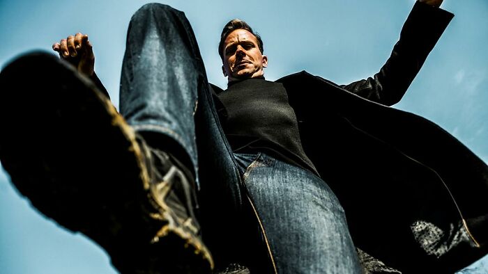 Hollywood Star from a low angle, wearing a black turtleneck and jeans. The disgraced Hollywood Star from his comeback film. Hollywood Star from a low angle, wearing a black turtleneck and jeans. The disgraced Hollywood Star from his comeback film.