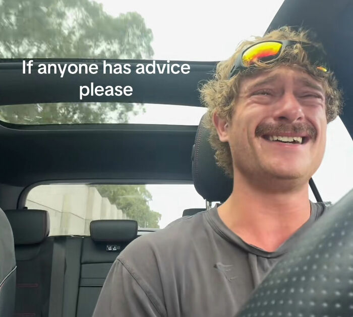 A lonely man with a mustache and sunglasses, crying and laughing while driving, making a plea for advice. A lonely man with a mustache and sunglasses, crying and laughing while driving, making a plea for advice.