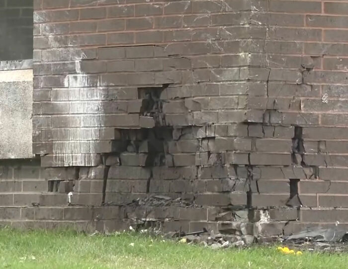 A damaged brick wall, showing the impact from the crash related to Mackenzie Shirilla's legal setback. A damaged brick wall, showing the impact from the crash related to Mackenzie Shirilla's legal setback.