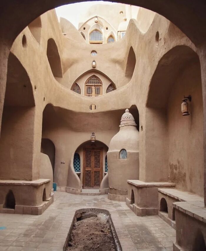 A stunning architectural design with multiple arches and intricate doorways in a historic interior setting, showcasing remarkable designs.
