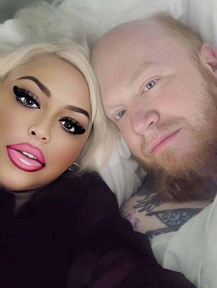 A couple in bed, with the woman's face heavily filtered, highlighting people who didn't try to look natural on social media.
