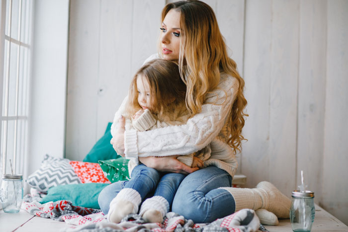 A mother embracing her child, conveying emotion related to the husband's violent reaction to an allergic SIL. A mother embracing her child, conveying emotion related to the husband's violent reaction to an allergic SIL.