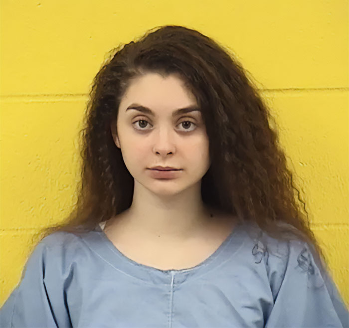 Mackenzie Shirilla prison photo after legal setback, she wears a light blue uniform against a yellow wall. Mackenzie Shirilla prison photo after legal setback, she wears a light blue uniform against a yellow wall.