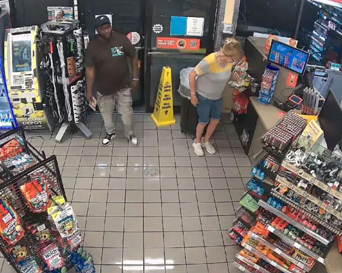 Overhead view of a man and a woman in a convenience store, connected to stupid arrests.