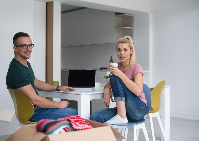 A happy young couple at home, smiling and having coffee. The guy uses autism as an excuse to tear into sis. A happy young couple at home, smiling and having coffee. The guy uses autism as an excuse to tear into sis.