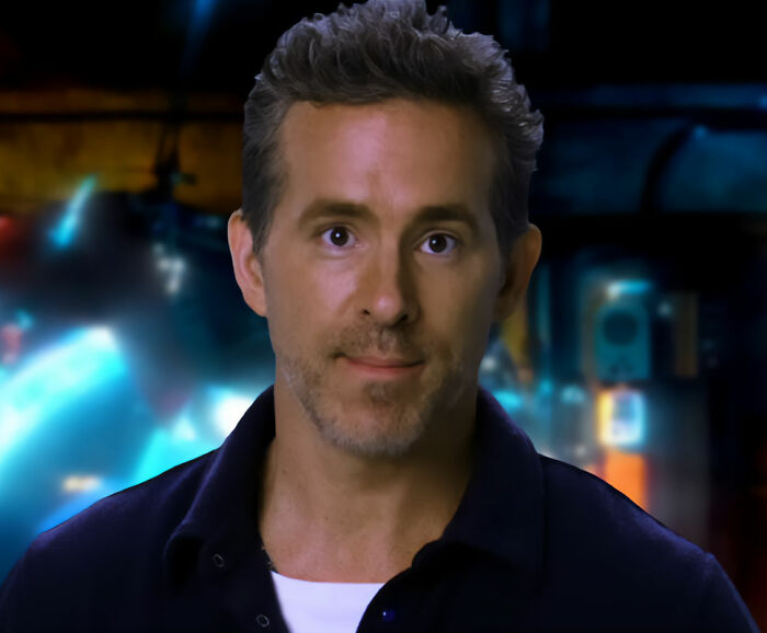 Close-up of Ryan Reynolds facing Hollywood backlash, with projects falling apart. Insiders reveal why he isn't blacklisted.