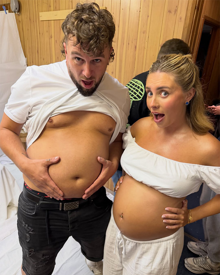 Bonnie Blue, an adult star, and a man playfully show off their baby bump and belly, respectively, during a July 4 event.