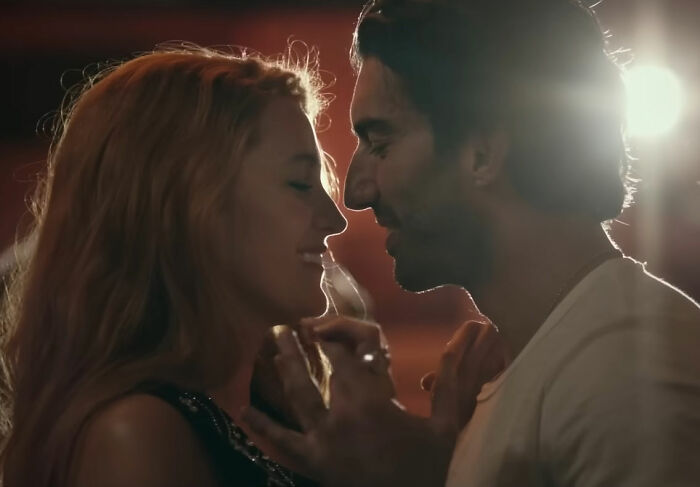 Ryan Reynolds in a romantic scene, showing his appeal despite Hollywood backlash.