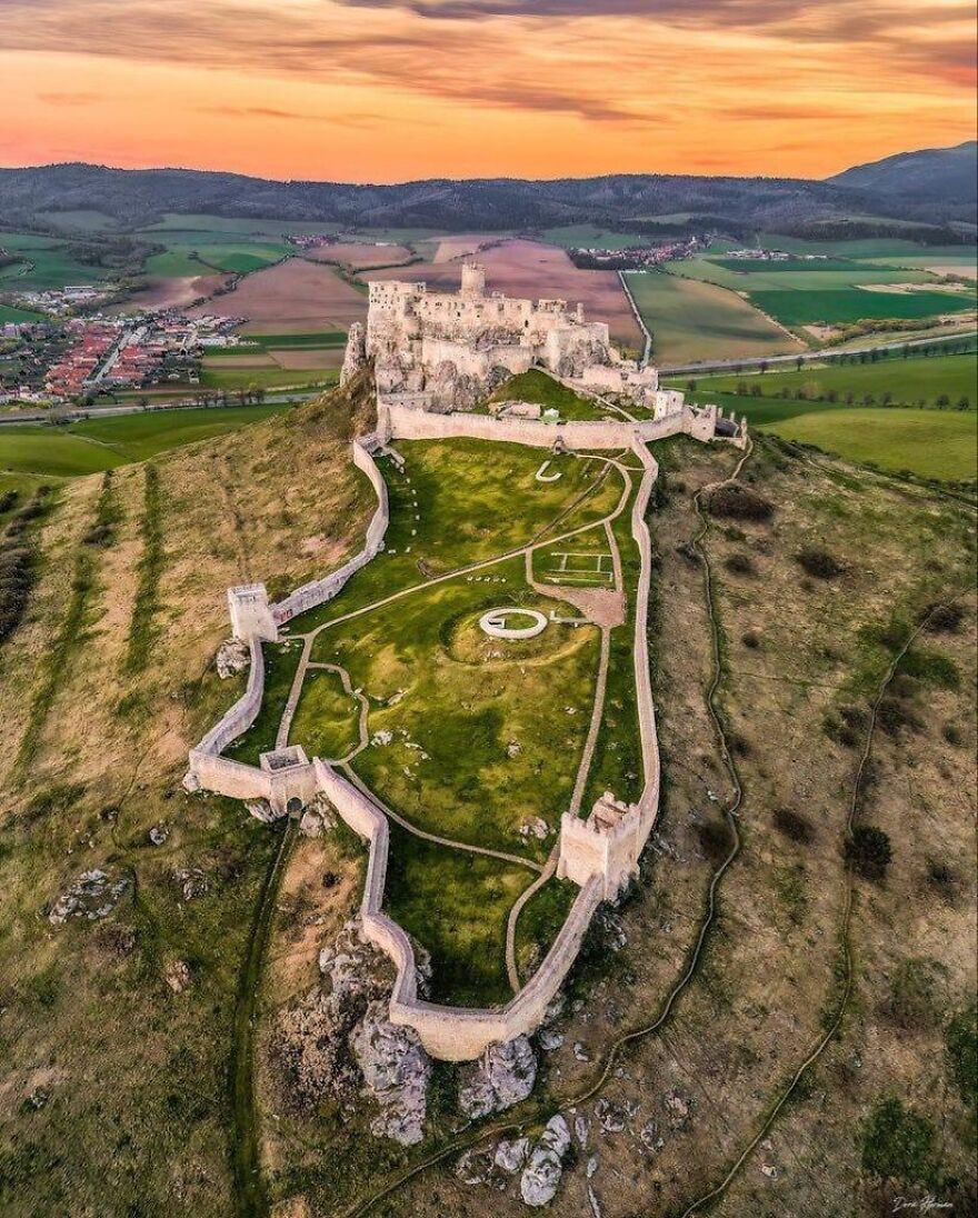 Aerial view of Spis Castle, a beautiful and interesting medieval fortress on a hill at sunset.