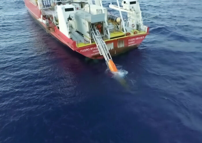 A red research vessel, the Fugro Brasilis, deploys equipment into the ocean to locate the crashed Pan Am plane. A red research vessel, the Fugro Brasilis, deploys equipment into the ocean to locate the crashed Pan Am plane.