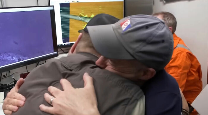 Two men hugging and celebrating after the Pan Am plane that crashed in 1952 was finally found. Two men hugging and celebrating after the Pan Am plane that crashed in 1952 was finally found.