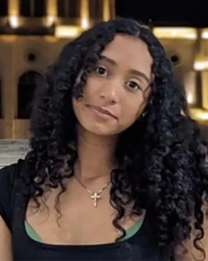 Celeste Rivas with long curly hair and a gold cross necklace, central to D4vd's text messages and relationship. Celeste Rivas with long curly hair and a gold cross necklace, central to D4vd's text messages and relationship.