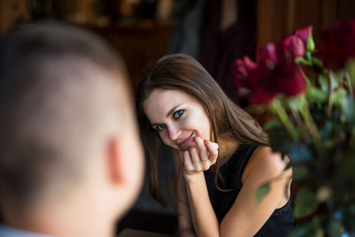 Woman looking at someone, symbolizing the acquaintance's cheating GF situation and friends.