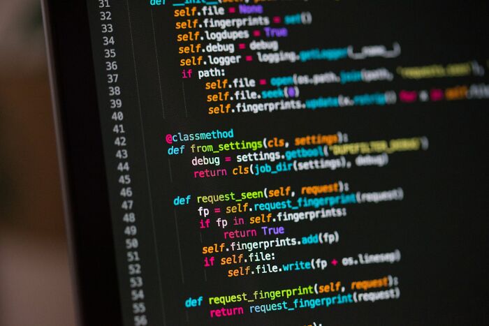 A close-up of computer code on a dark screen, representing one of the internet's unsolved mysteries.