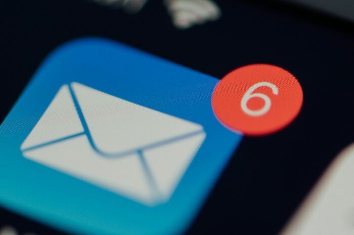 A close-up of a digital mail icon with a red notification bubble showing the number 6, suggesting internet mysteries.