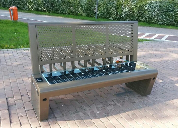 A park bench with solar panels, a brilliant example of designers transforming ordinary things.