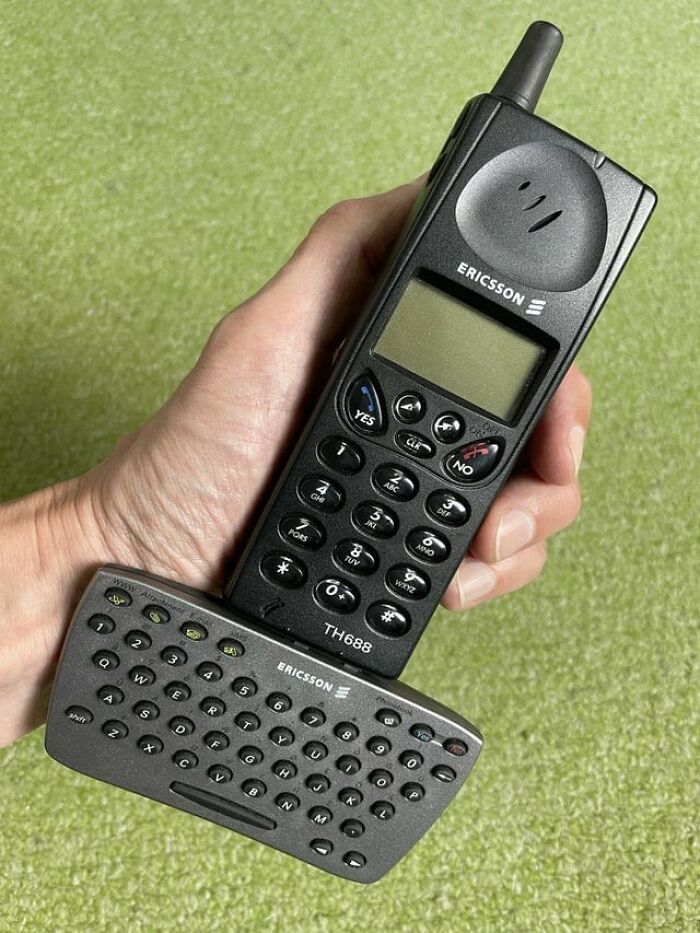 An Ericsson phone with an attached miniature keyboard, showcasing designers transforming ordinary things.