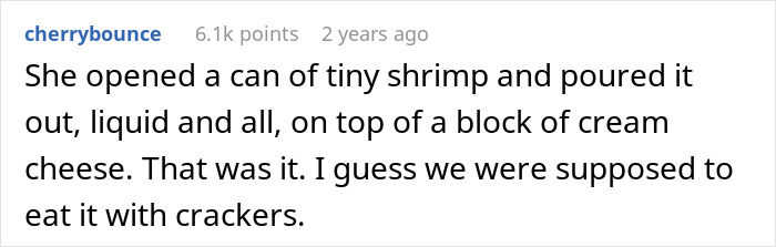 A block of cream cheese topped with canned tiny shrimp and its liquid, an example of disgusting food.