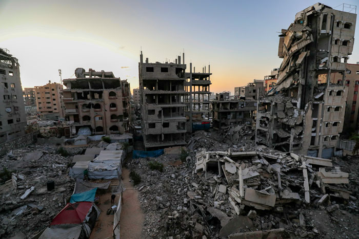 Destroyed buildings and rubble indicate widespread damage, reflecting the aftermath of nuclear war.