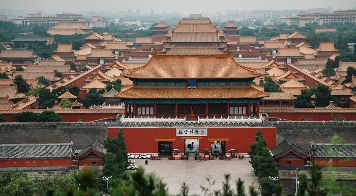 A wide view of the Forbidden City with its distinctive red walls and golden roofs, representing Chinese student academic rigor. A wide view of the Forbidden City with its distinctive red walls and golden roofs, representing Chinese student academic rigor.