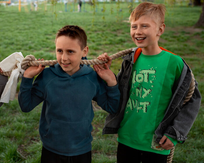 Two boys with a rope, symbolizing unbelievable childhood experiences and play.