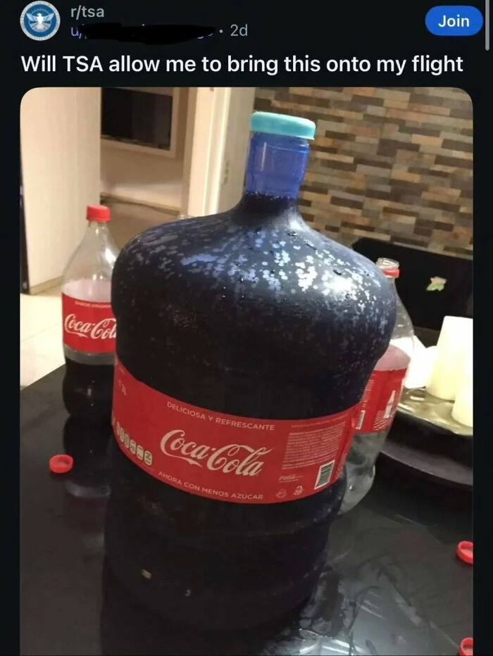 A giant bottle of Coca-Cola on a table, a cringe post questioning if TSA allows it on a flight.