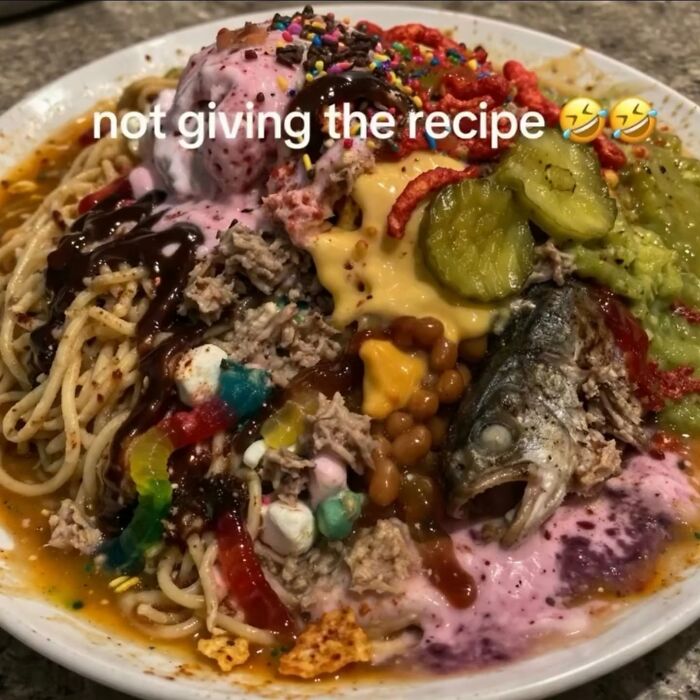 A plate filled with an unusual mix of food, including noodles, fish, and ice cream, making a cringe post.