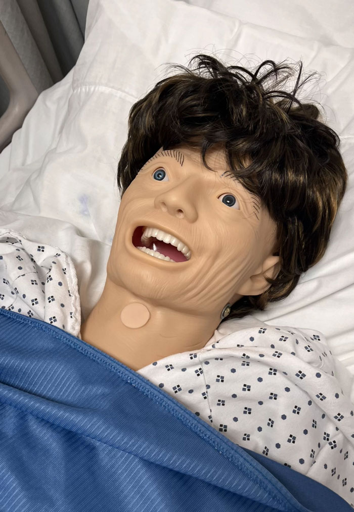 A medical dummy with curly brown hair and wide eyes, one of the camera roll photos that need no explanation.