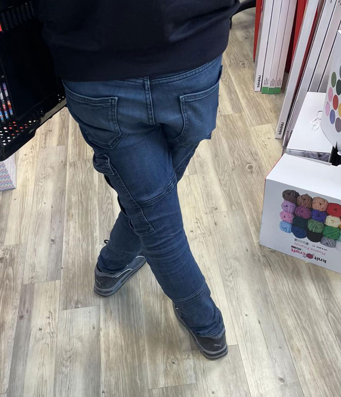 A person in jeans with their legs crossed, an odd camera roll photo that needs no explanation.