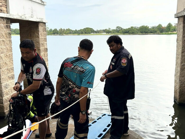 Emergency responders by a lake, investigating the bizarre incident involving the Looksmaxxer.