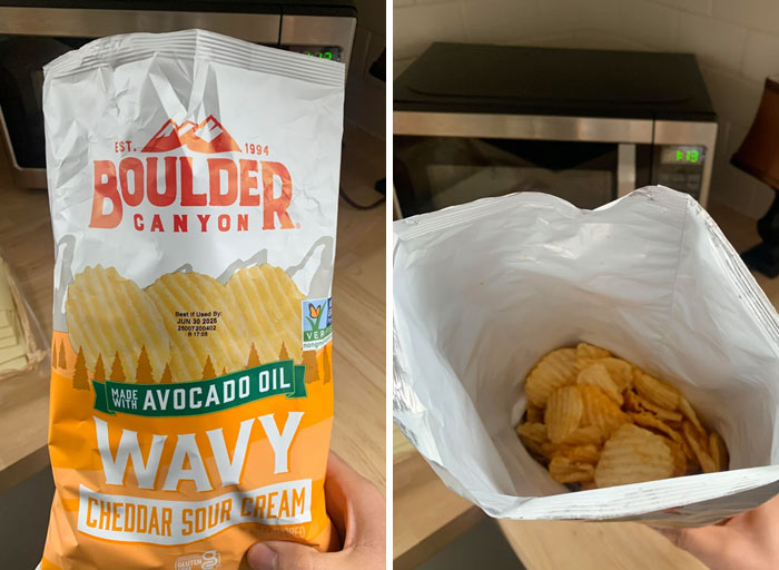 A bag of Wavy Cheddar Sour Cream chips with very few chips inside, showcasing misleading marketing.