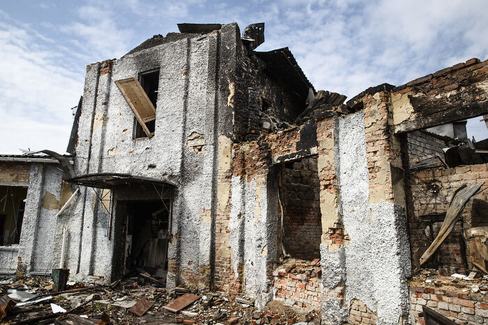 A bombed-out building, charred and crumbling under a blue sky, an extraordinary story from World War II.