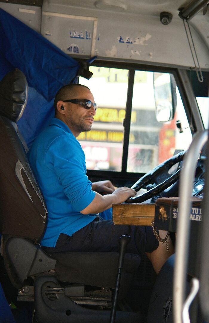 A bus driver in sunglasses, focused on the road, symbolizing adult HR problems in the workplace.