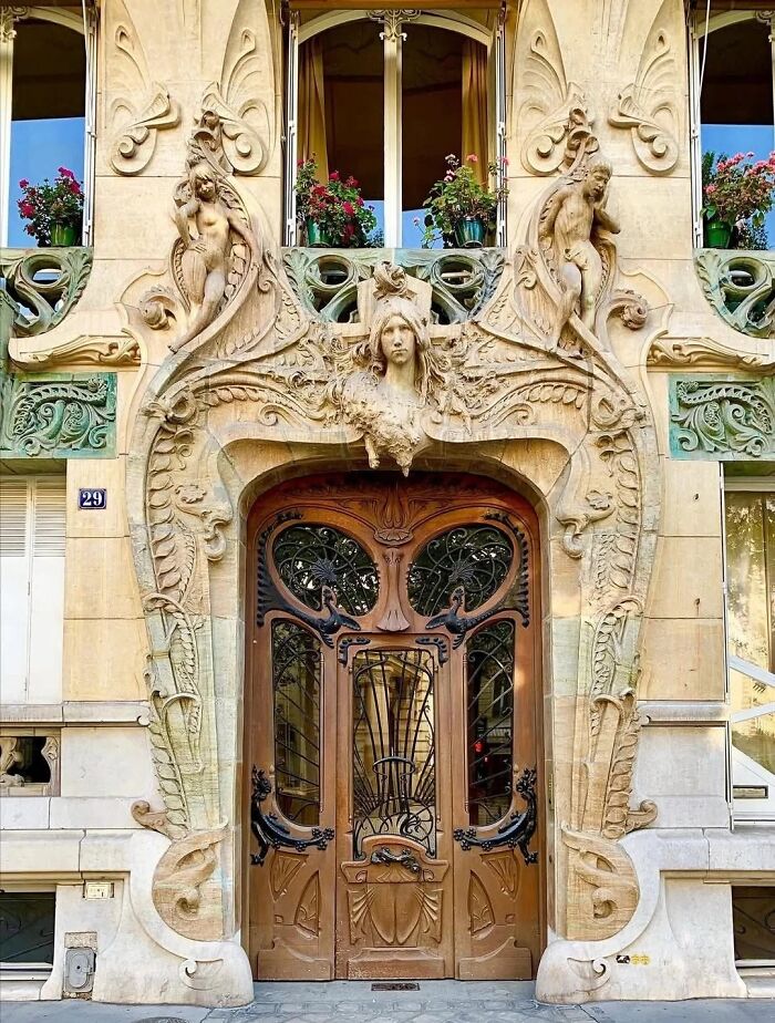 Remarkable Designs of an iconic ornate wooden door with intricate carvings and decorative stonework.