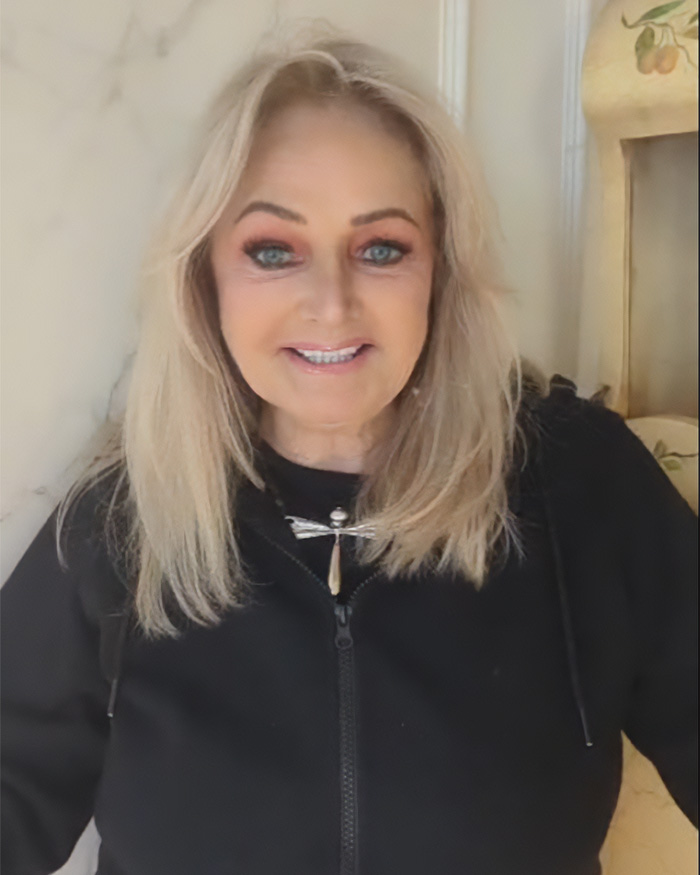 Bonnie Tyler, the 'Holding Out For A Hero' icon, smiling at the camera, wearing a black zip-up top. Bonnie Tyler, the 'Holding Out For A Hero' icon, smiling at the camera, wearing a black zip-up top.