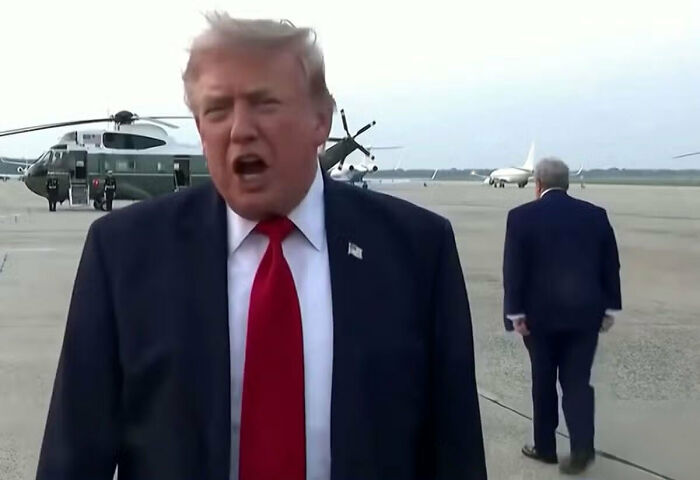 Donald Trump speaking while another man walks away, raising a body double conspiracy theory. Donald Trump speaking while another man walks away, raising a body double conspiracy theory.