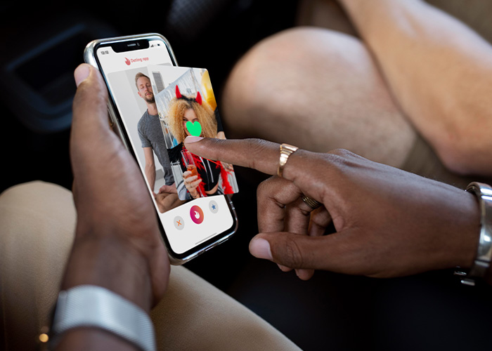 A person using a smartphone with a dating app interface, illustrating the new dating method dominating California colleges. A person using a smartphone with a dating app interface, illustrating the new dating method dominating California colleges.