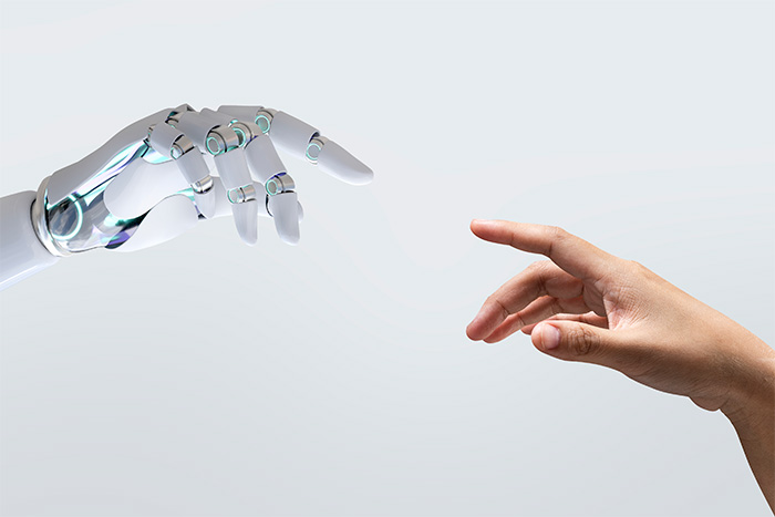 A human hand and a robot hand reaching towards each other, symbolizing the dystopian new dating method taking over California colleges. A human hand and a robot hand reaching towards each other, symbolizing the dystopian new dating method taking over California colleges.