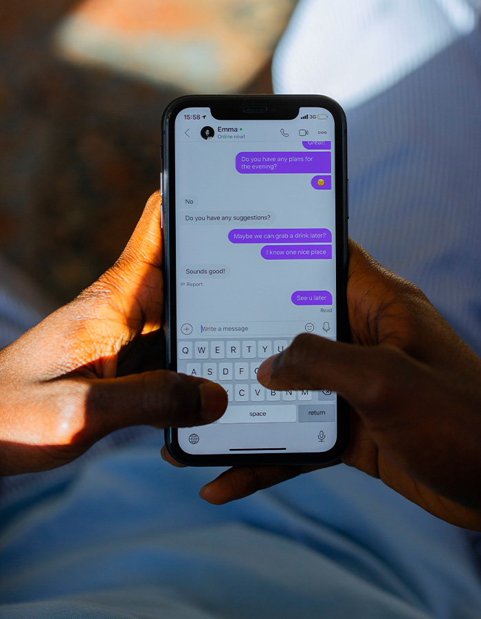A person using a phone, texting, symbolizing the dystopian new dating method in California colleges, replacing Tinder. A person using a phone, texting, symbolizing the dystopian new dating method in California colleges, replacing Tinder.