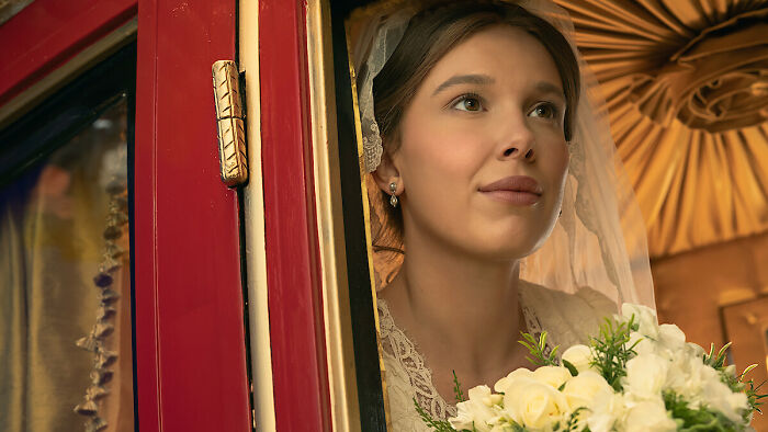 Millie Bobby Brown as a bride in a new movie, amidst lip filler controversy and iPhone face look. Millie Bobby Brown as a bride in a new movie, amidst lip filler controversy and iPhone face look.
